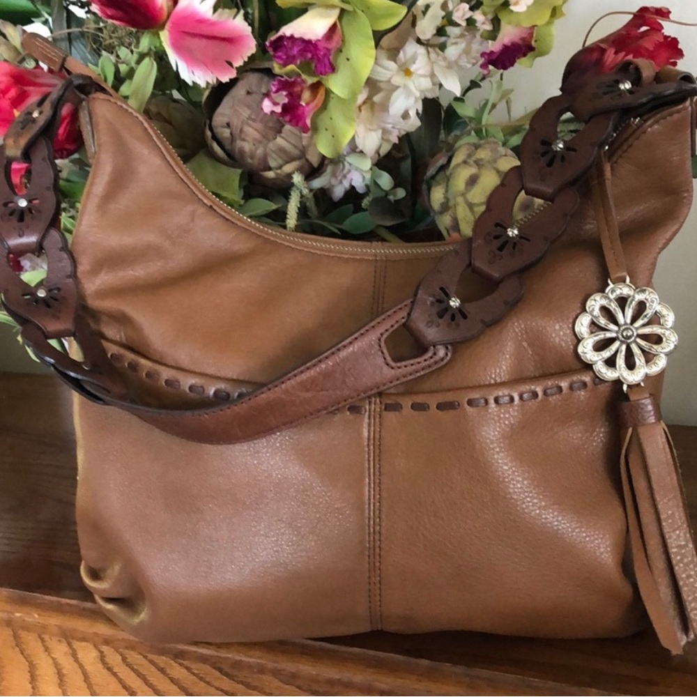 Brighton “KODIAK”
Brown leather hobo style purse